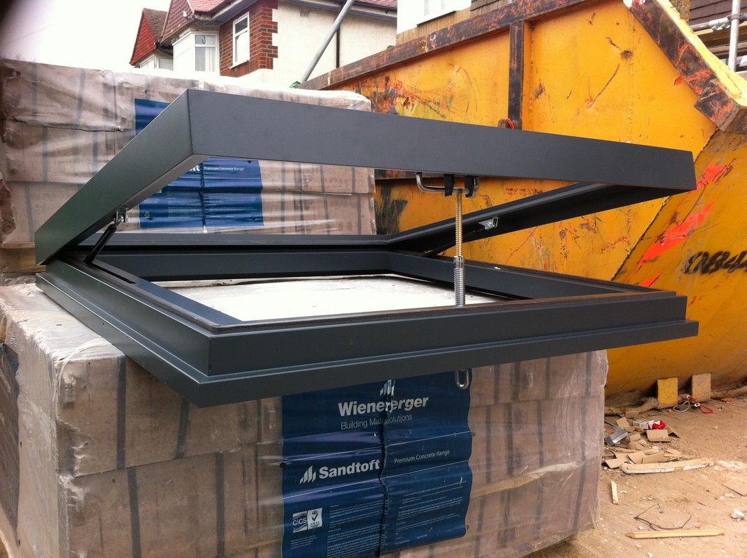 Opening flat roof skylight in anthracite grey installed in Hither Green