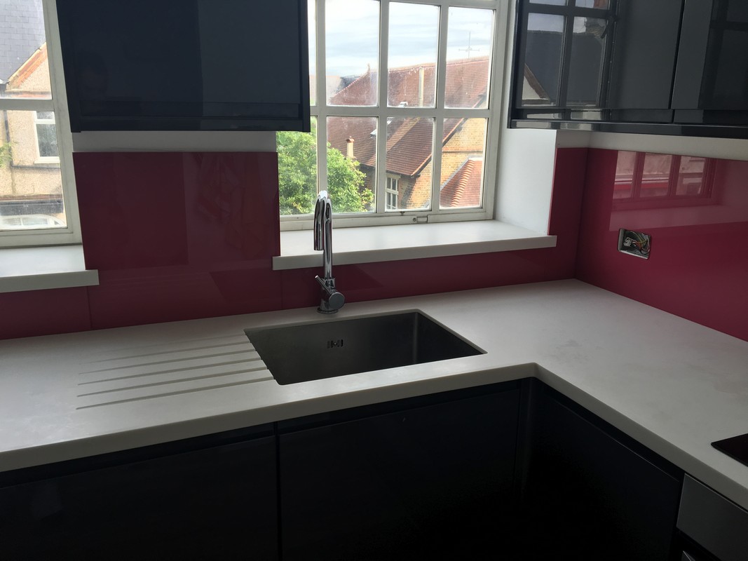 Deep plum coloured glass splashback in modern Hither Green kitchen