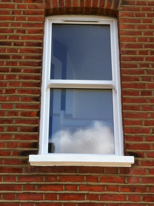 uPVC sash window on Victorian red brick house in Hither Green